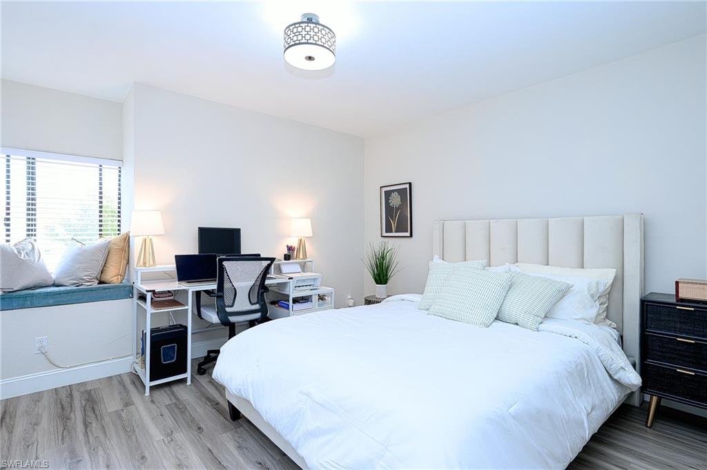 2nd bedroom with desk and TV
