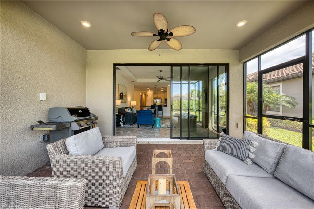 Screened patio featuring a brick paver floor and recessed lighting