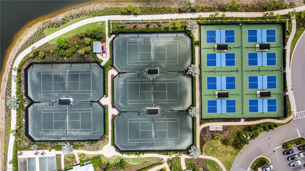 Aerial perspective showcasing multiple recreational courts, including six green tennis courts, eight blue and green pickleball courts, and perimeter landscaping