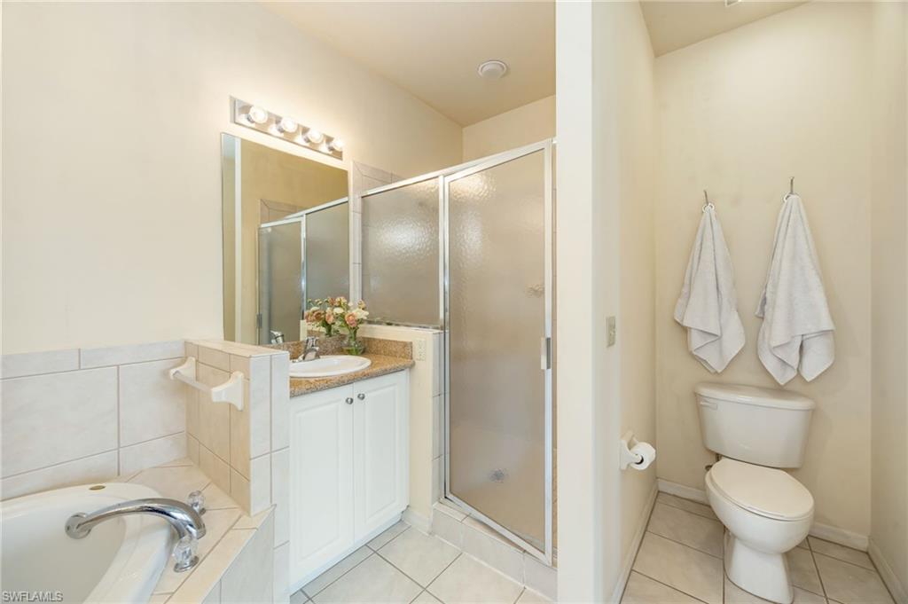 Primary bath with soaking tub, walk-in shower complete with  dual vanities.
