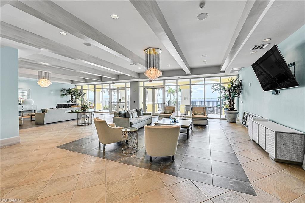 Building lobby with beam ceiling and recessed lighting