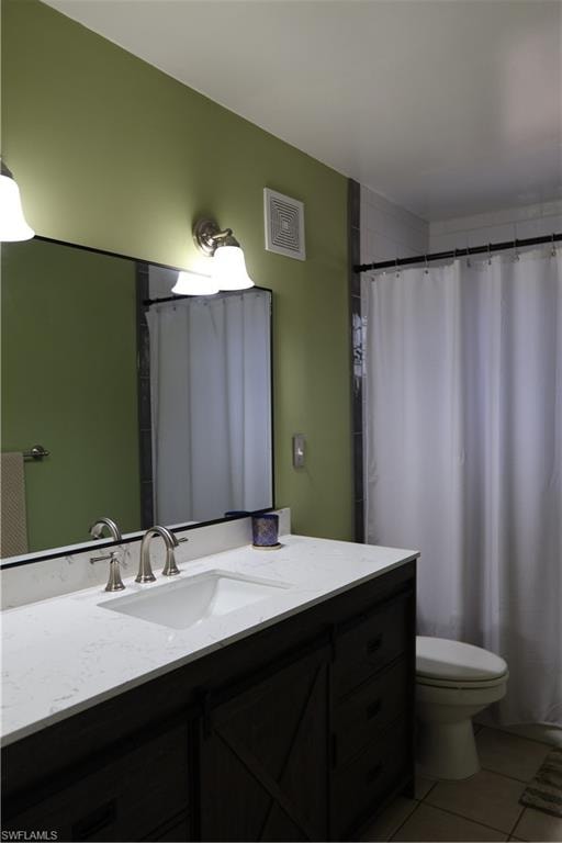 Bathroom featuring a dark wood-finish vanity with a white countertop and undermount sink, brushed nickel faucet, and a wall-mounted mirror