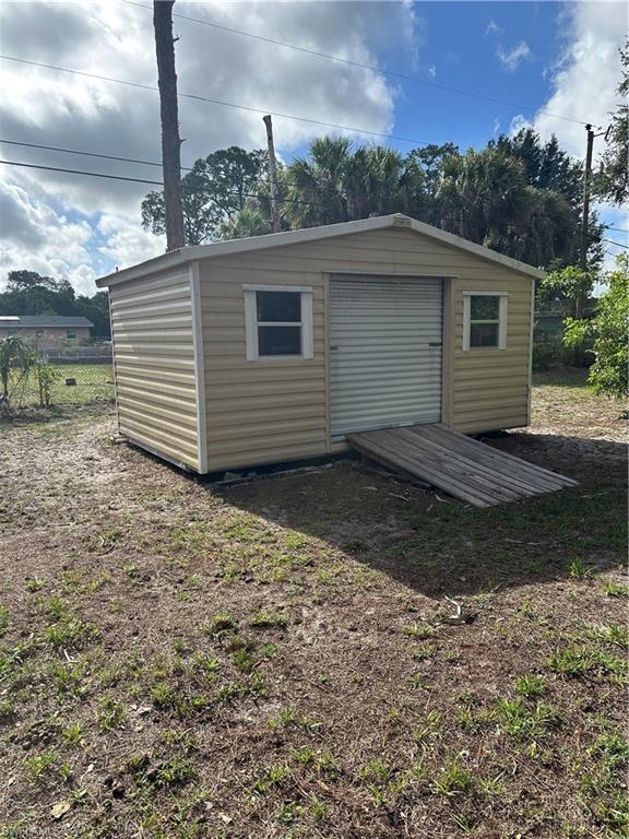 Freestanding shed with horizontal siding and a gable roof
