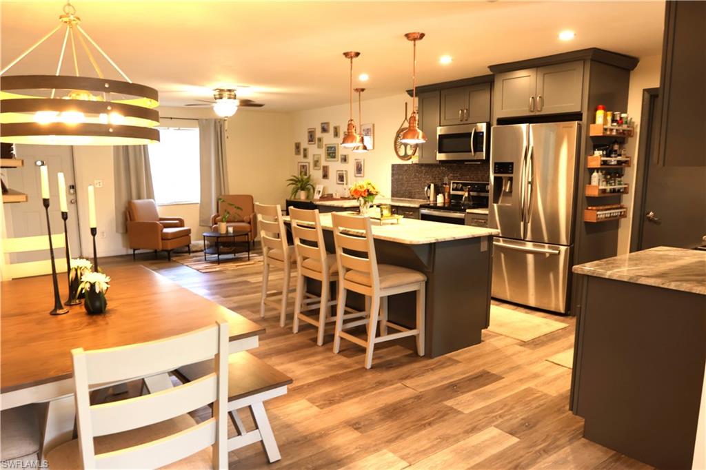 Open-concept living space featuring wood-finish flooring throughout