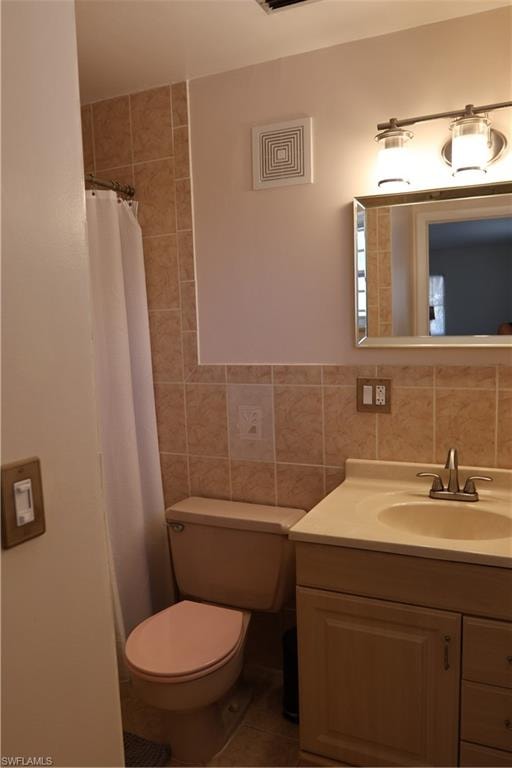 Bathroom vanity with a cream-toned countertop, undermount sink, and brushed nickel faucet