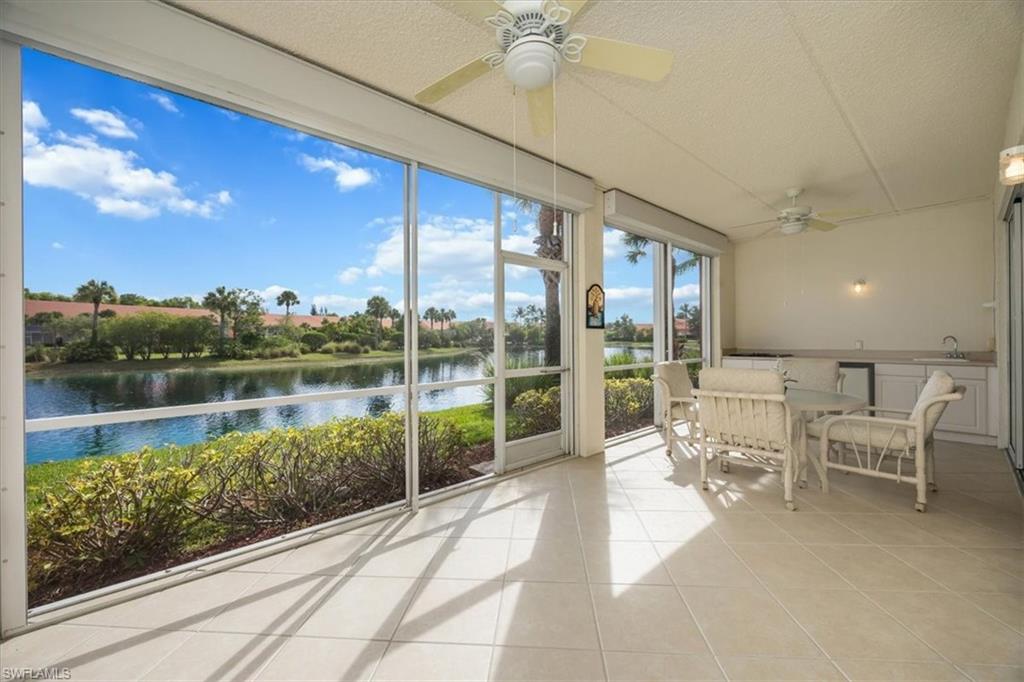 Large lanai with electric storm shutters and summer kitchen