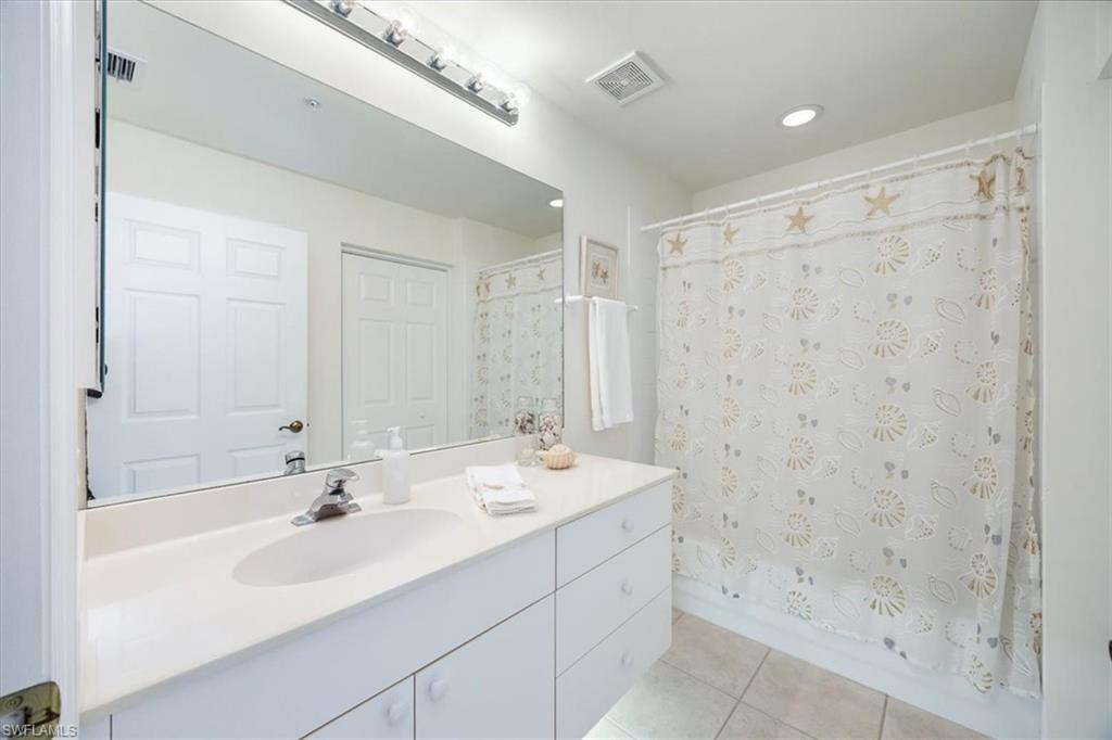 Full guest bathroom has a linen closet