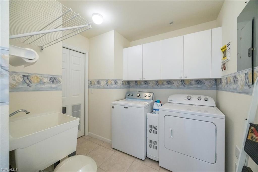 Spacious laundry room with utility sink