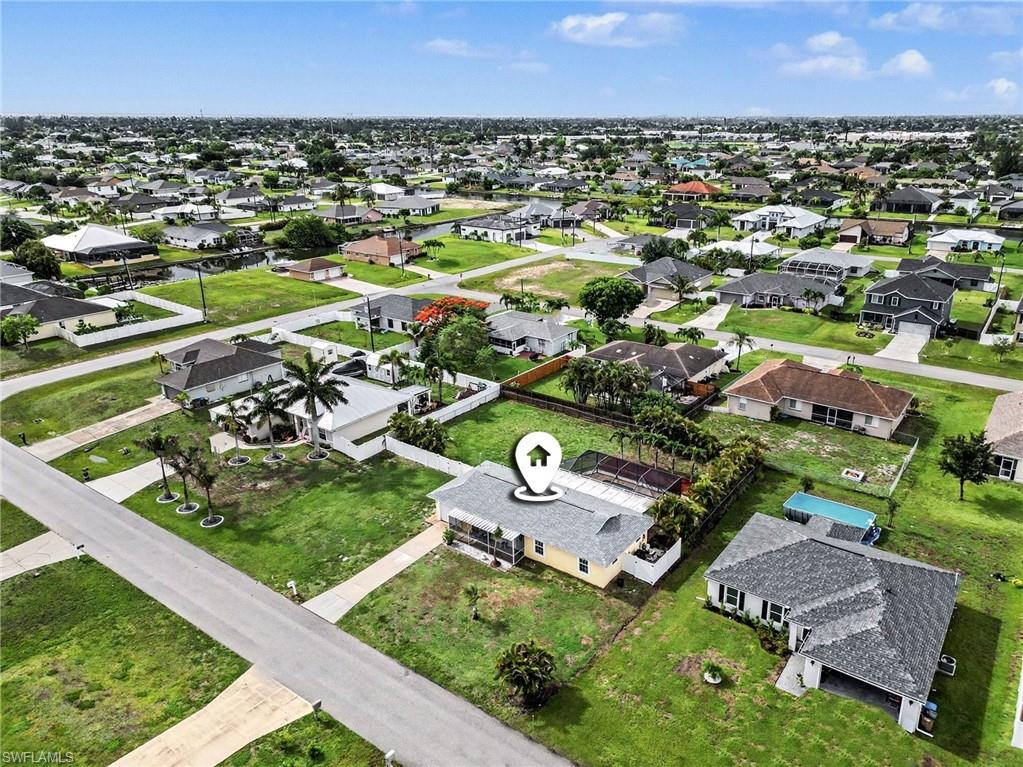 Established residential neighborhood featuring a variety of single-story homes, maintained lawns, and mature landscaping