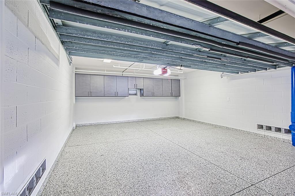 2-Car garage epoxy floor built-in cabinets