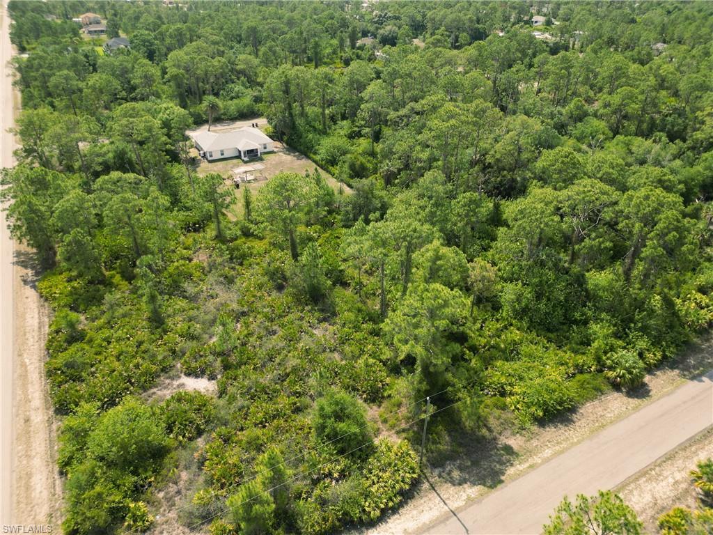 View from above of property featuring a forest