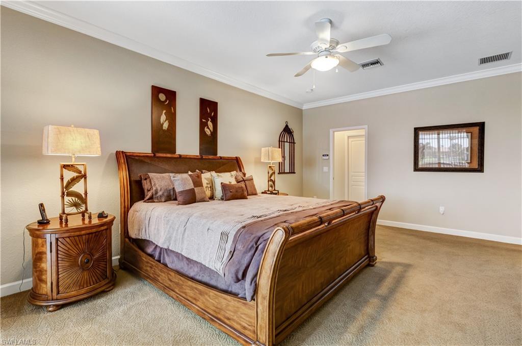 Primary Suite features sliding doors to pool area