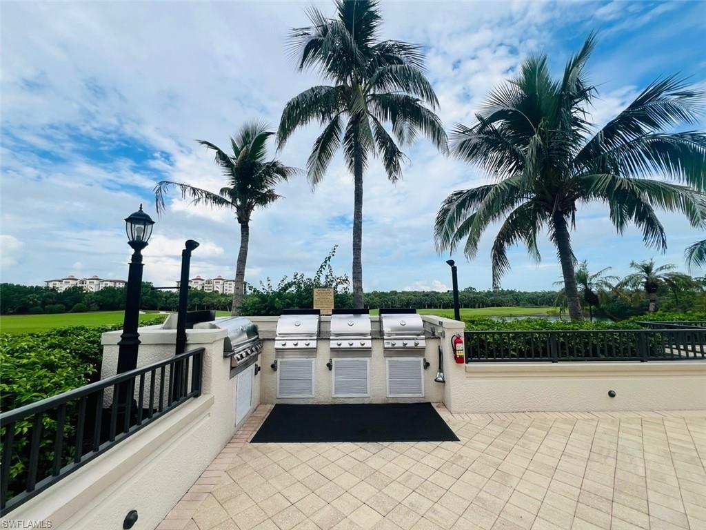 View of patio with a grill and an outdoor kitchen
