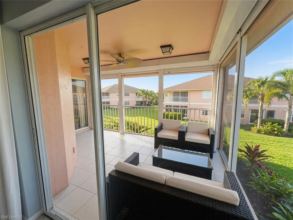 Screened lanai featuring tile flooring, a ceiling fan, and recessed lighting