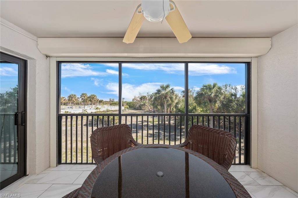 Screened balcony featuring expansive outdoor scenery