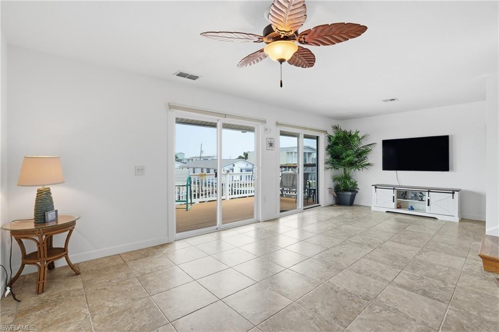 Spacious interior featuring tile flooring and white walls