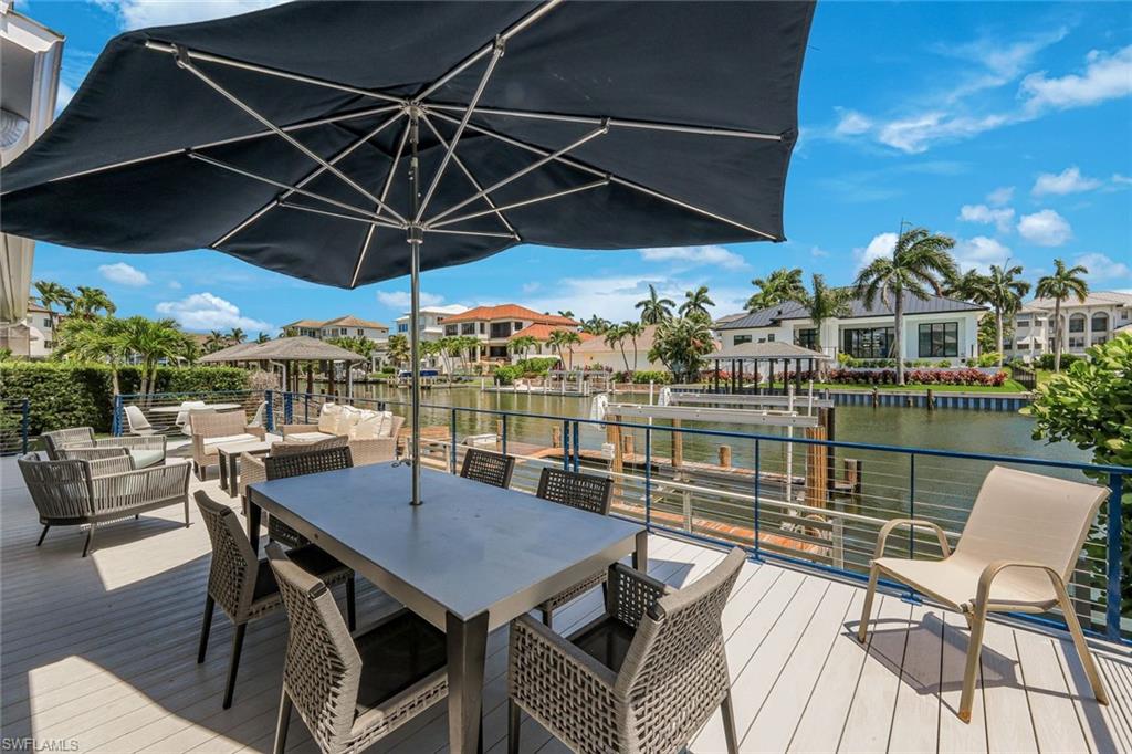 Expansive outdoor deck with composite wood-look flooring and a durable metal railing
