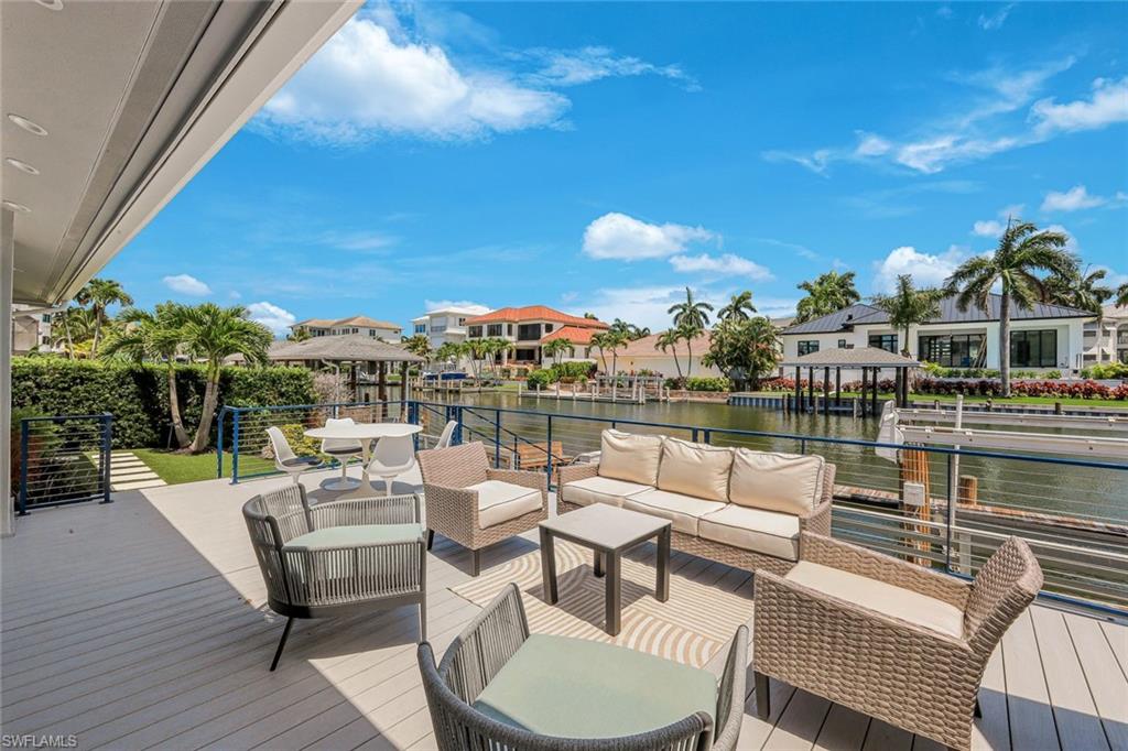 Expansive outdoor decking featuring a covered area and open-air spaces