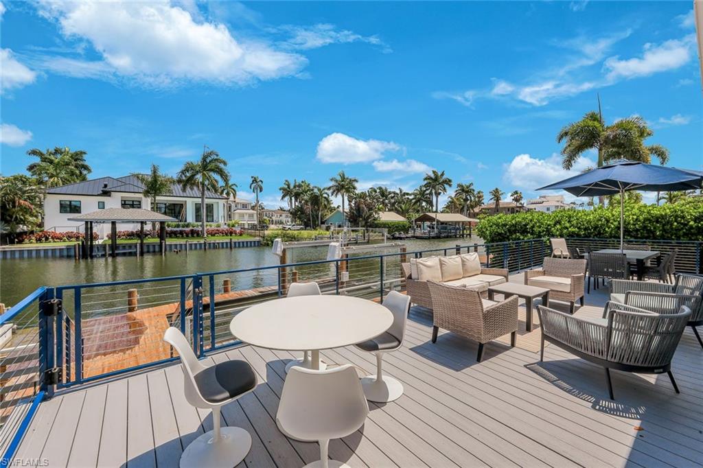 Expansive waterfront deck featuring composite decking and a cable railing system