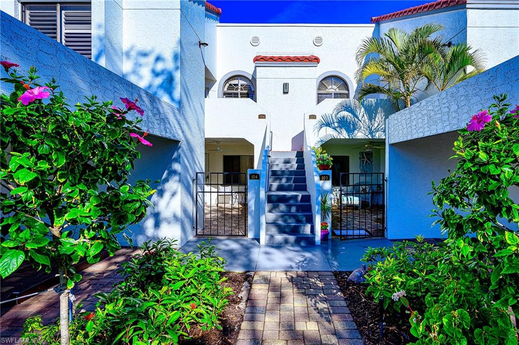 View of exterior entry featuring stucco siding