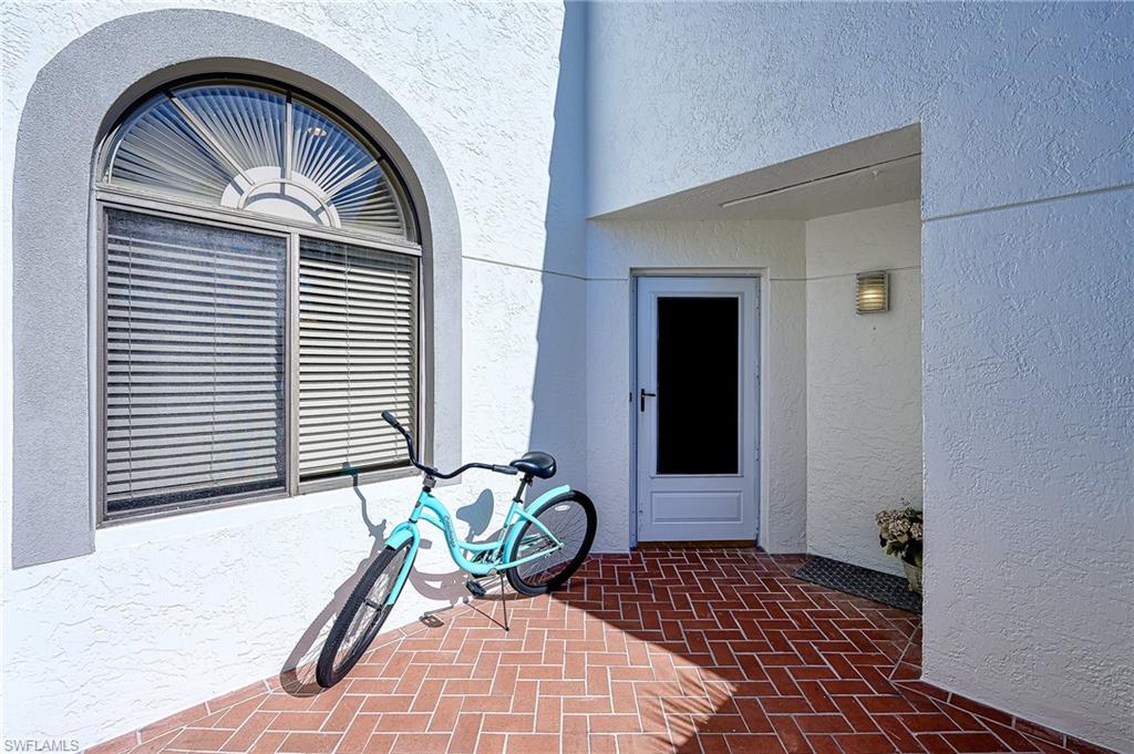 Property entrance featuring stucco siding