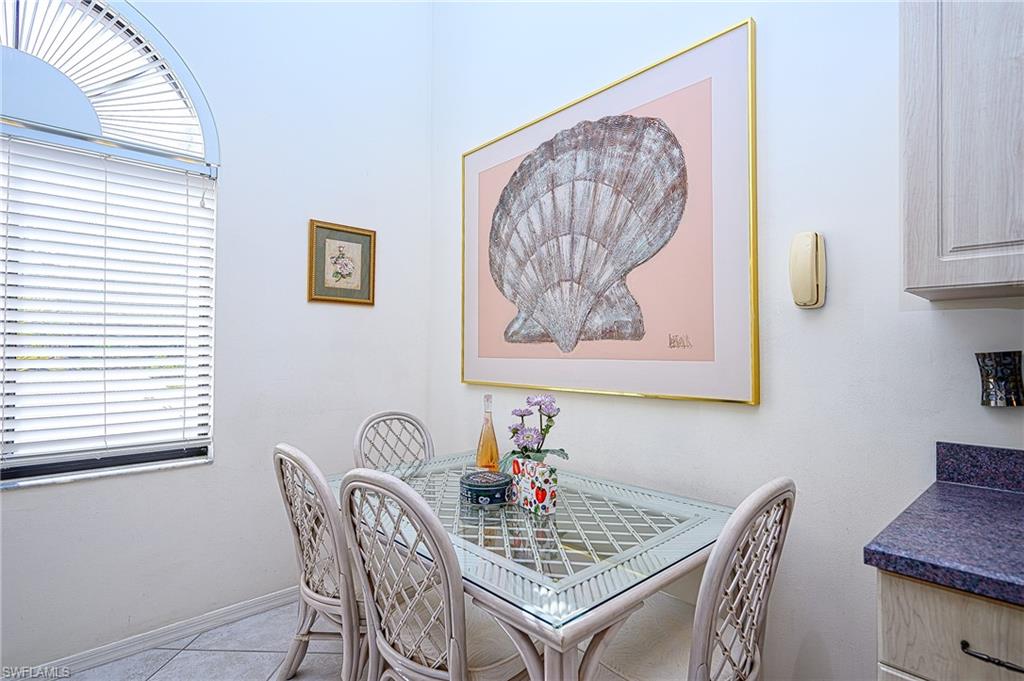 Dining room featuring tile patterned floors and baseboards