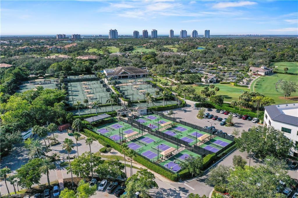 Extensive recreational facilities featuring multiple tennis courts, several pickleball courts, and a club building