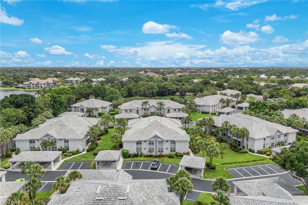 Expansive residential community featuring multiple multi-story buildings with light-colored roofs
