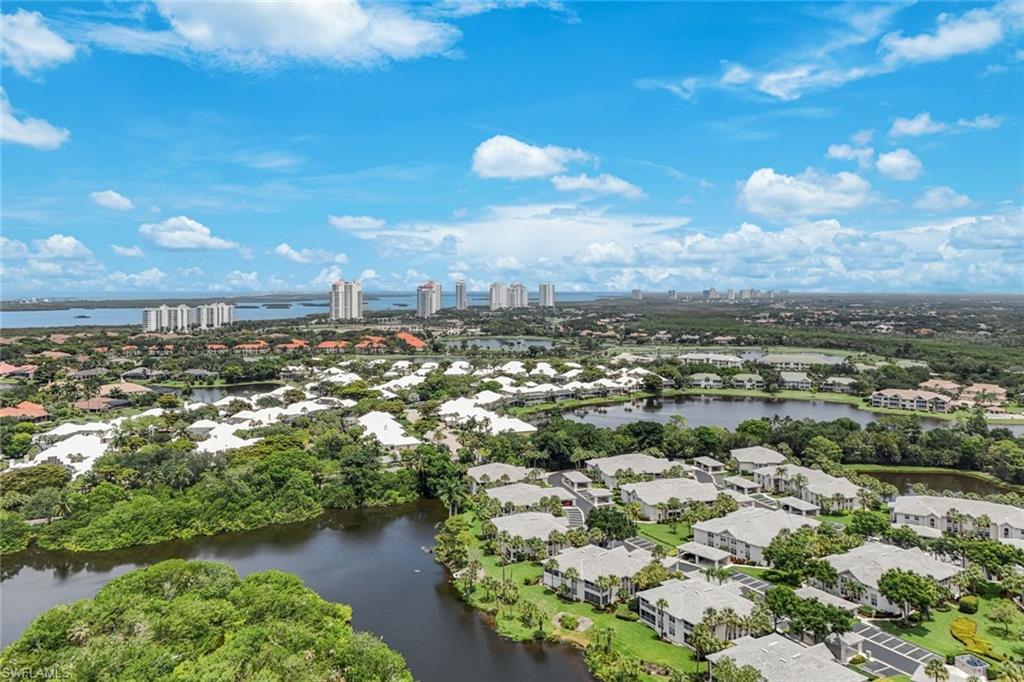 Aerial perspective showcasing a residential community with multiple lakes and lush landscaping