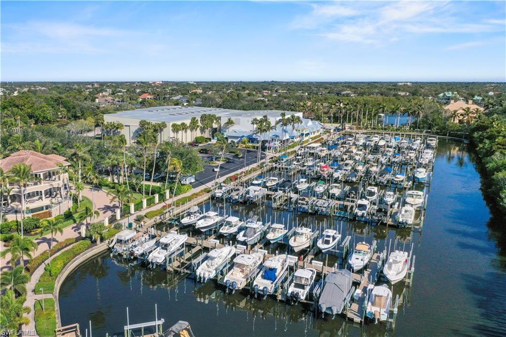 Expansive marina featuring multiple boat slips and direct water access