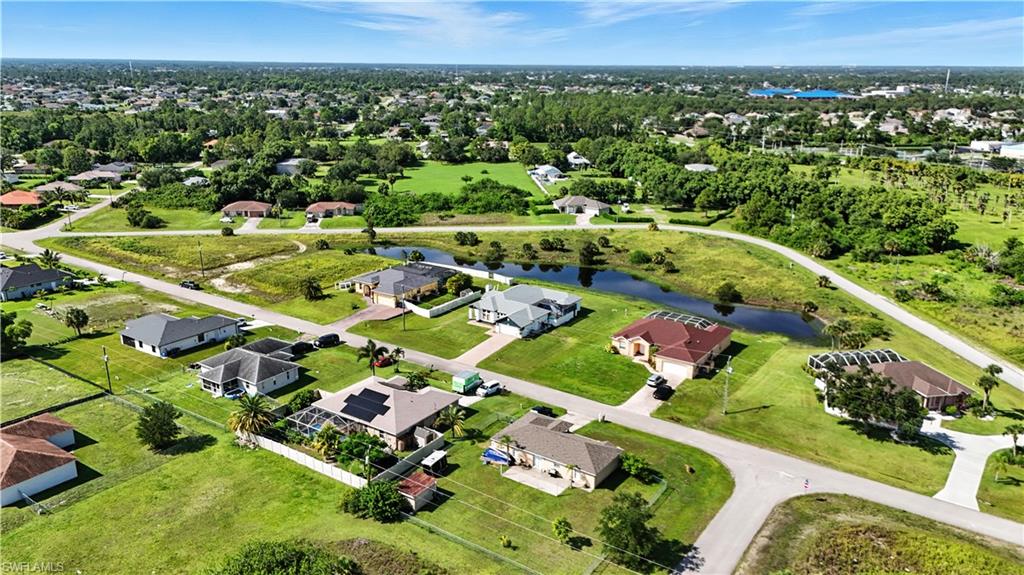 Aerial view of a residential neighborhood featuring single-story homes with various roof styles