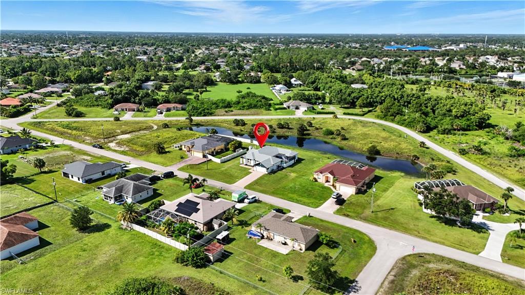 Aerial perspective showcasing a residential neighborhood with a prominent canal system