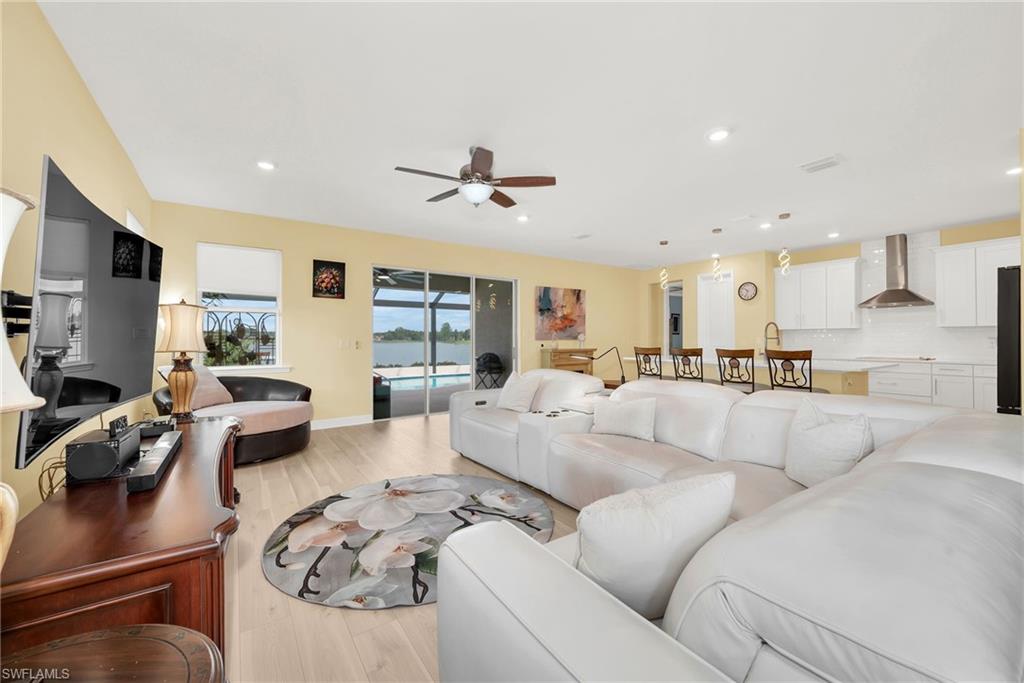 Open-concept interior featuring wood-finish flooring and a ceiling fan