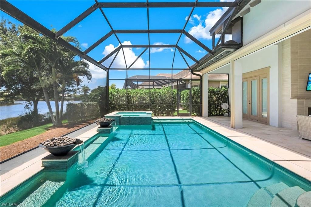 Peaceful pool setting featuring water and fire bowls