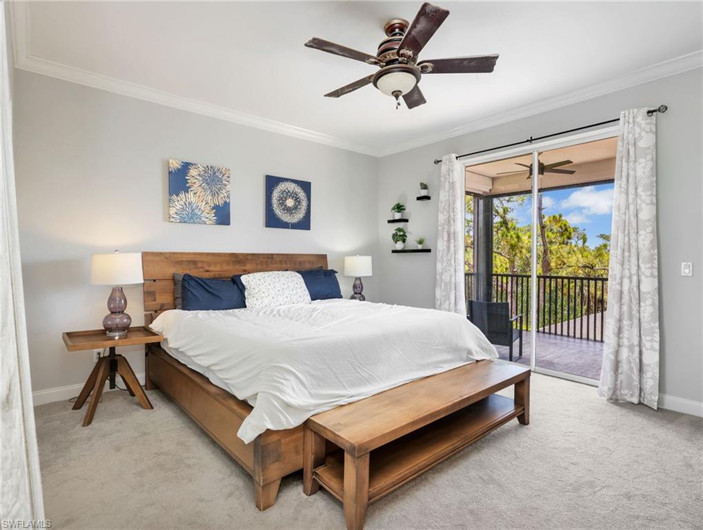 Spacious room featuring light gray walls, crown molding, and a ceiling fan