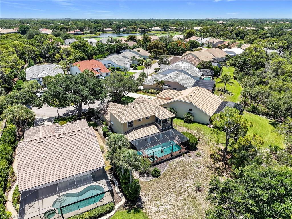 Aerial perspective of a residential neighborhood featuring multiple properties