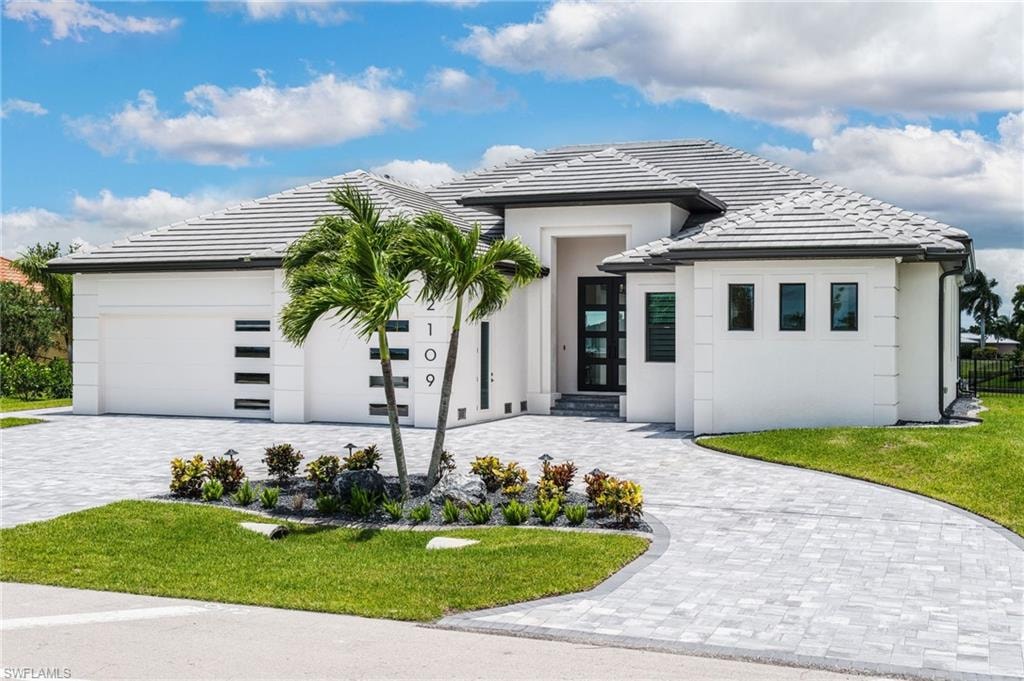 Contemporary white stucco exterior with a gray tile roof