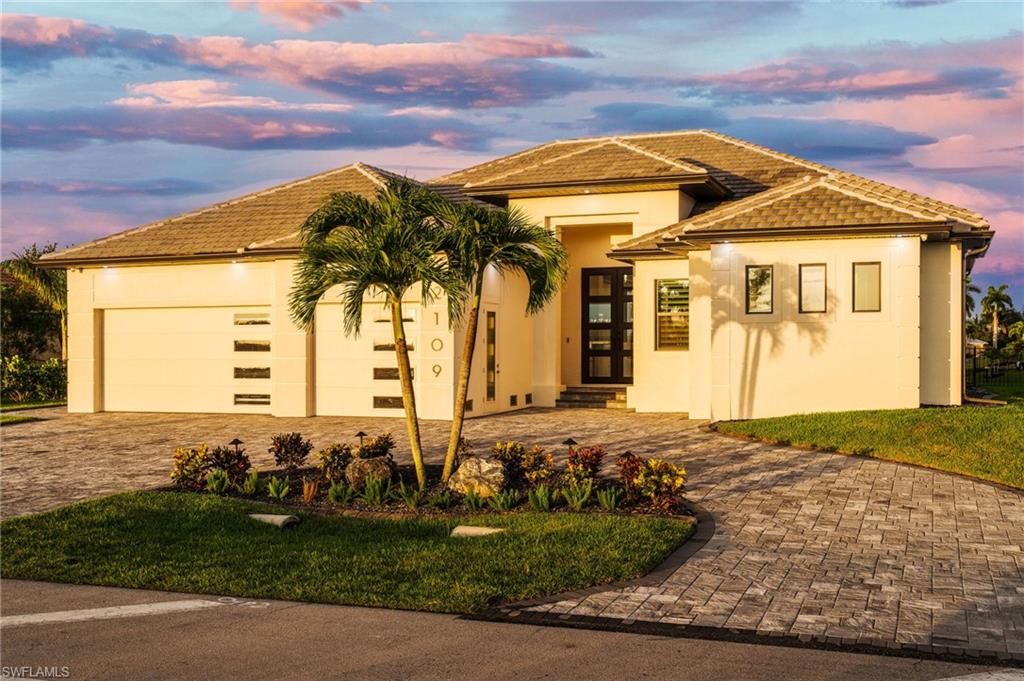 Contemporary stucco exterior with a tiled roof