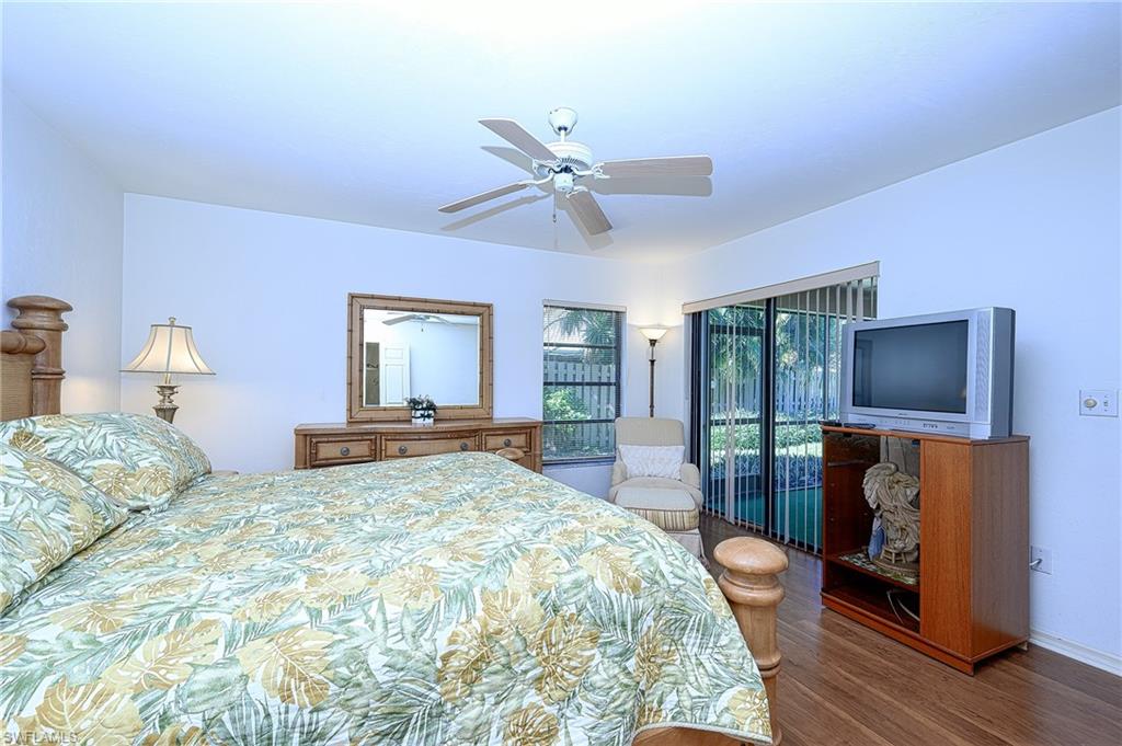 Bedroom featuring ceiling fan and wood-type flooring