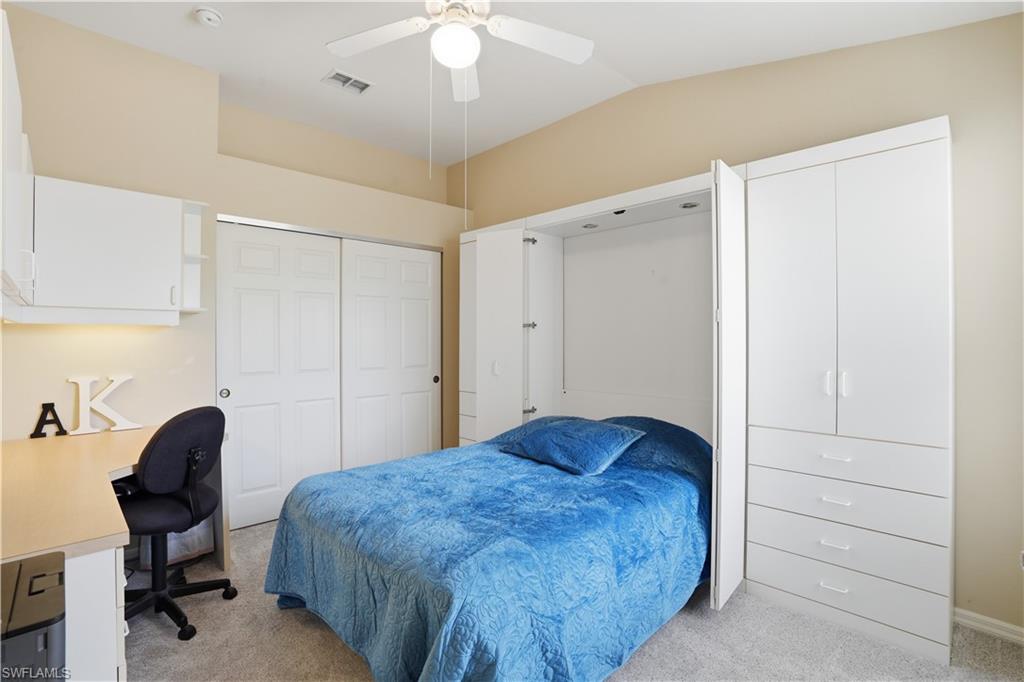 Guest bedroom with with a pull out murphy bed.