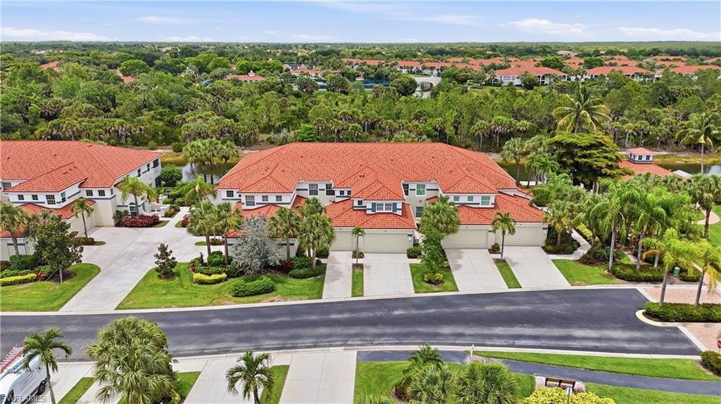 Aerial view of the residence and surrounding beautifully maintained community.