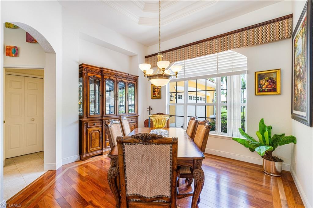 Formal dining room with wood floor