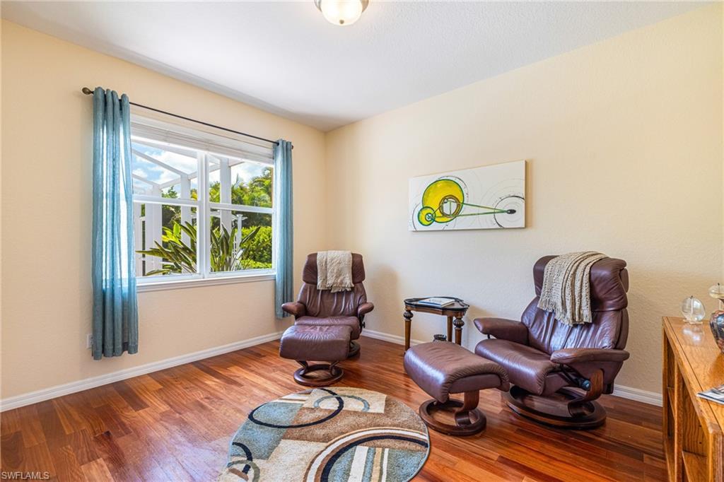 Sitting room/bedroom/office with wood floor