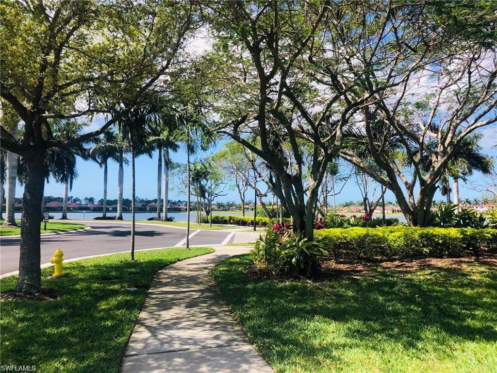 Lush landscaping and paths around the lake