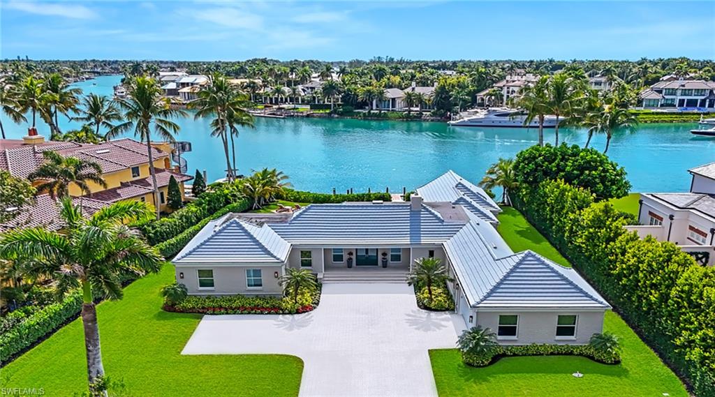 Aerial view of residential area featuring a large body of water
