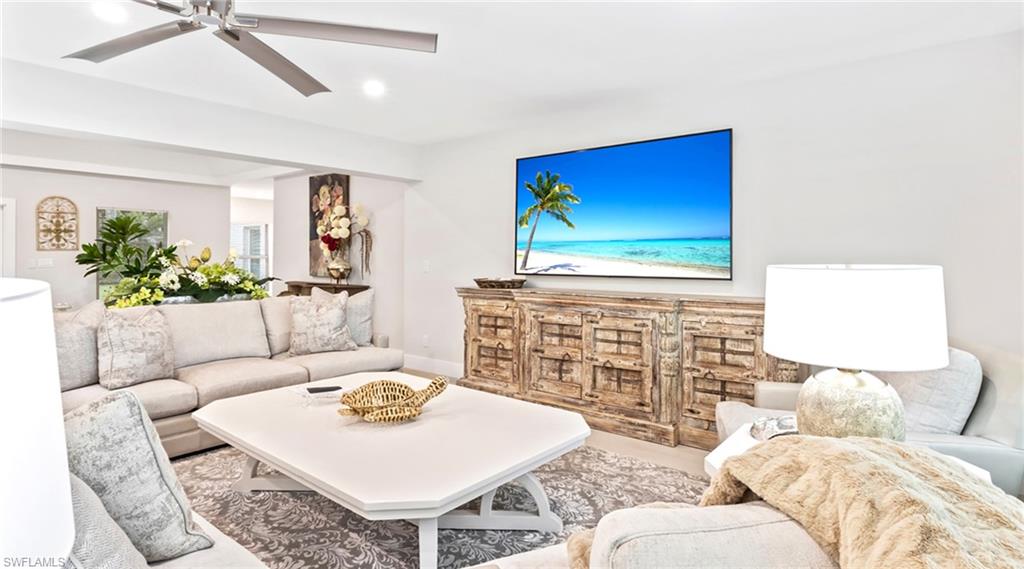 Living area featuring a ceiling fan and recessed lighting