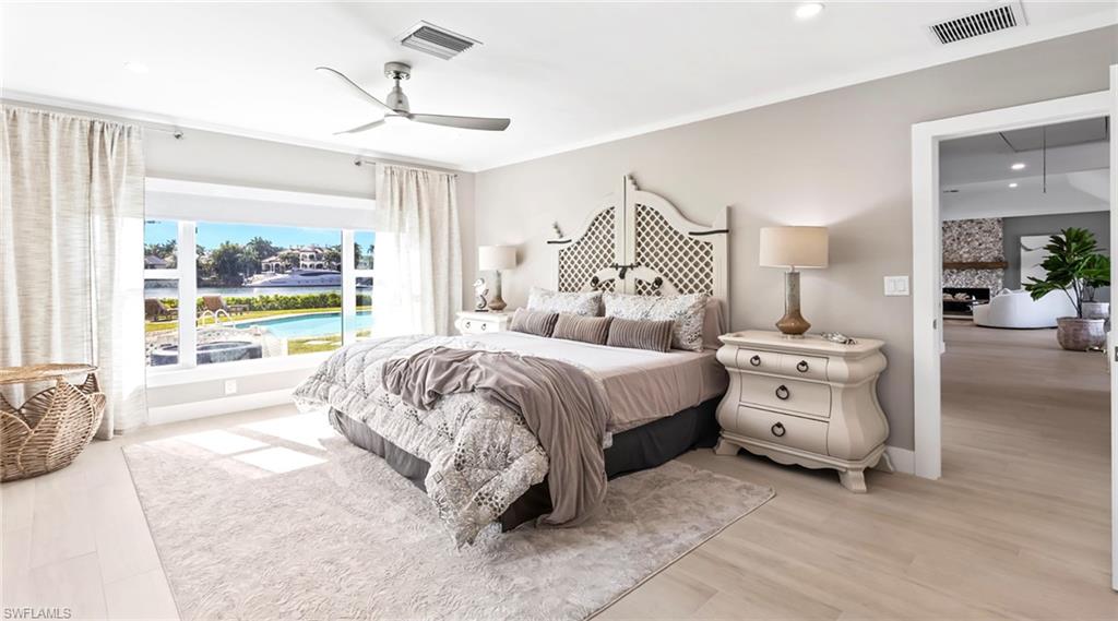 Bedroom with ceiling fan, recessed lighting, and light wood-style flooring