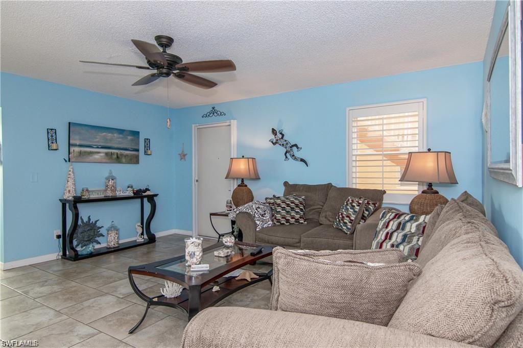Alternate view of the living room showcasing generous seating and easy flow.
