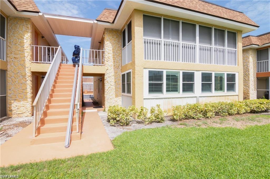 Exterior view of the low-rise Naples Florida condominium building.