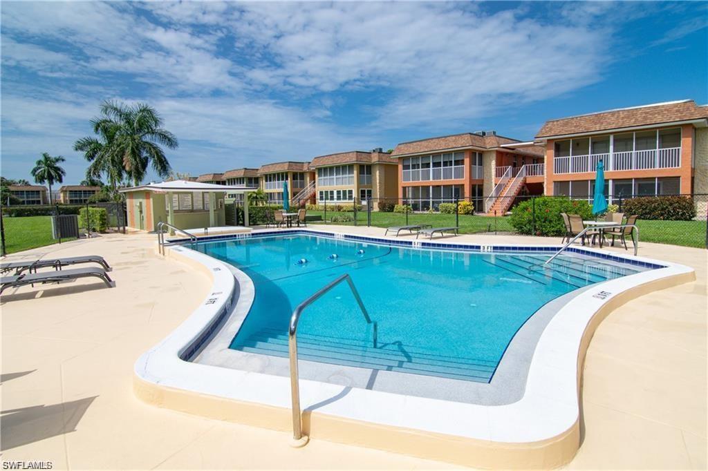 Another view of the community pool and surrounding outdoor amenities.